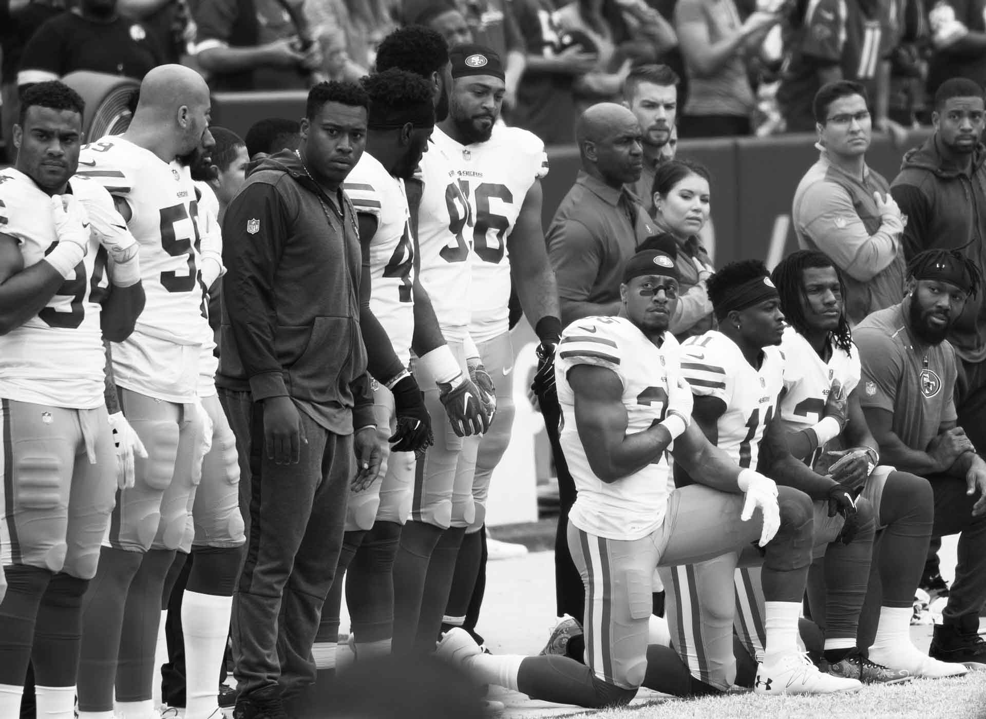 Some members of the San Francisco 49ers kneel during the National Anthem before a game against the Washington Redskins at FedEx Field on October 15, 2017 in Landover, Maryland.