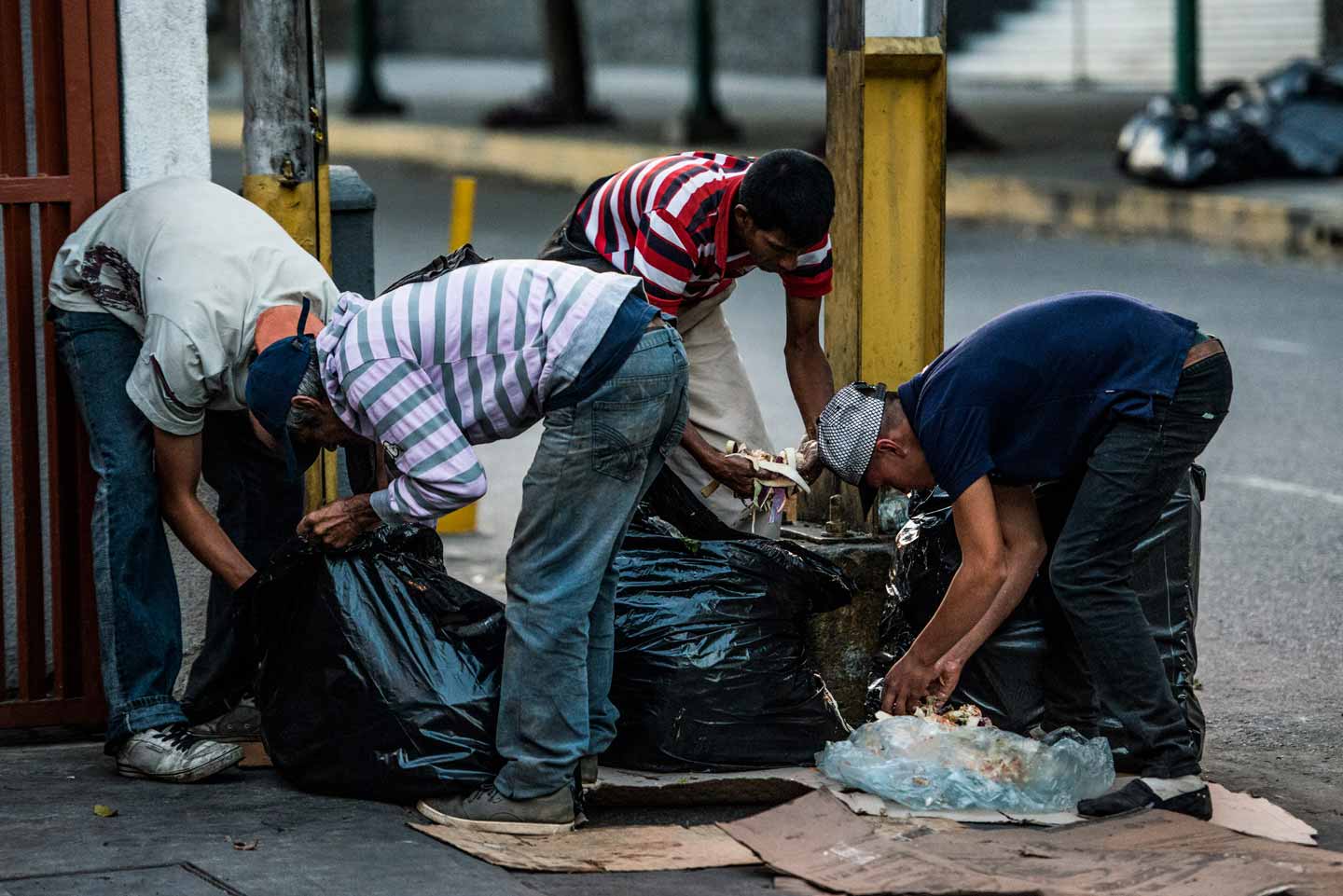 © Federico Parra. People scavenge for food in the streets of Caracas on February 22, 2017. Venezuelan The opposition blames Nicolas Maduro for an economic crisis that has caused food shortages.