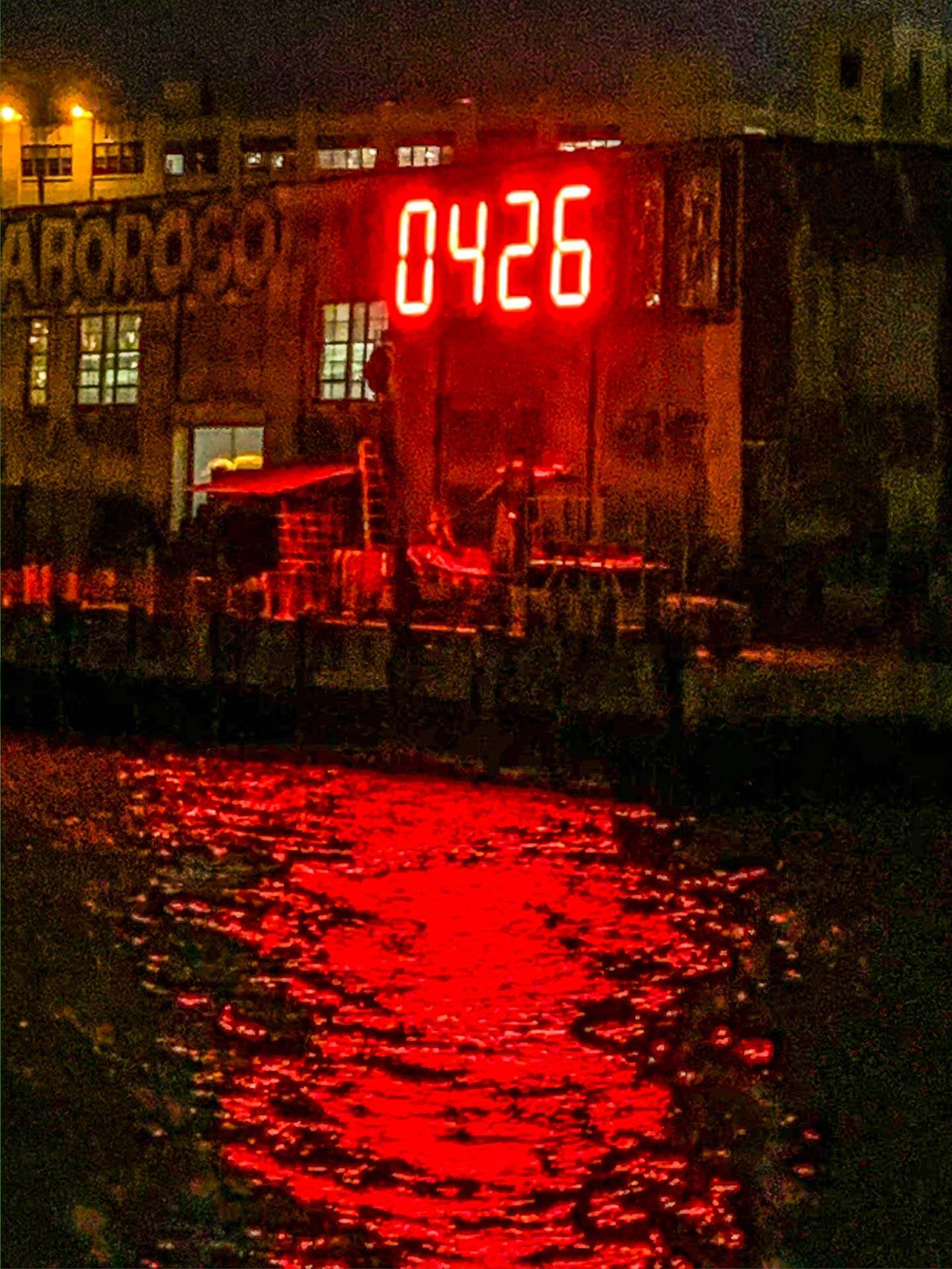 LIC-Clock © Mafe Izaguirre Digital numbers in color red showing as a giant clock on east river counting down days left in president trump's term