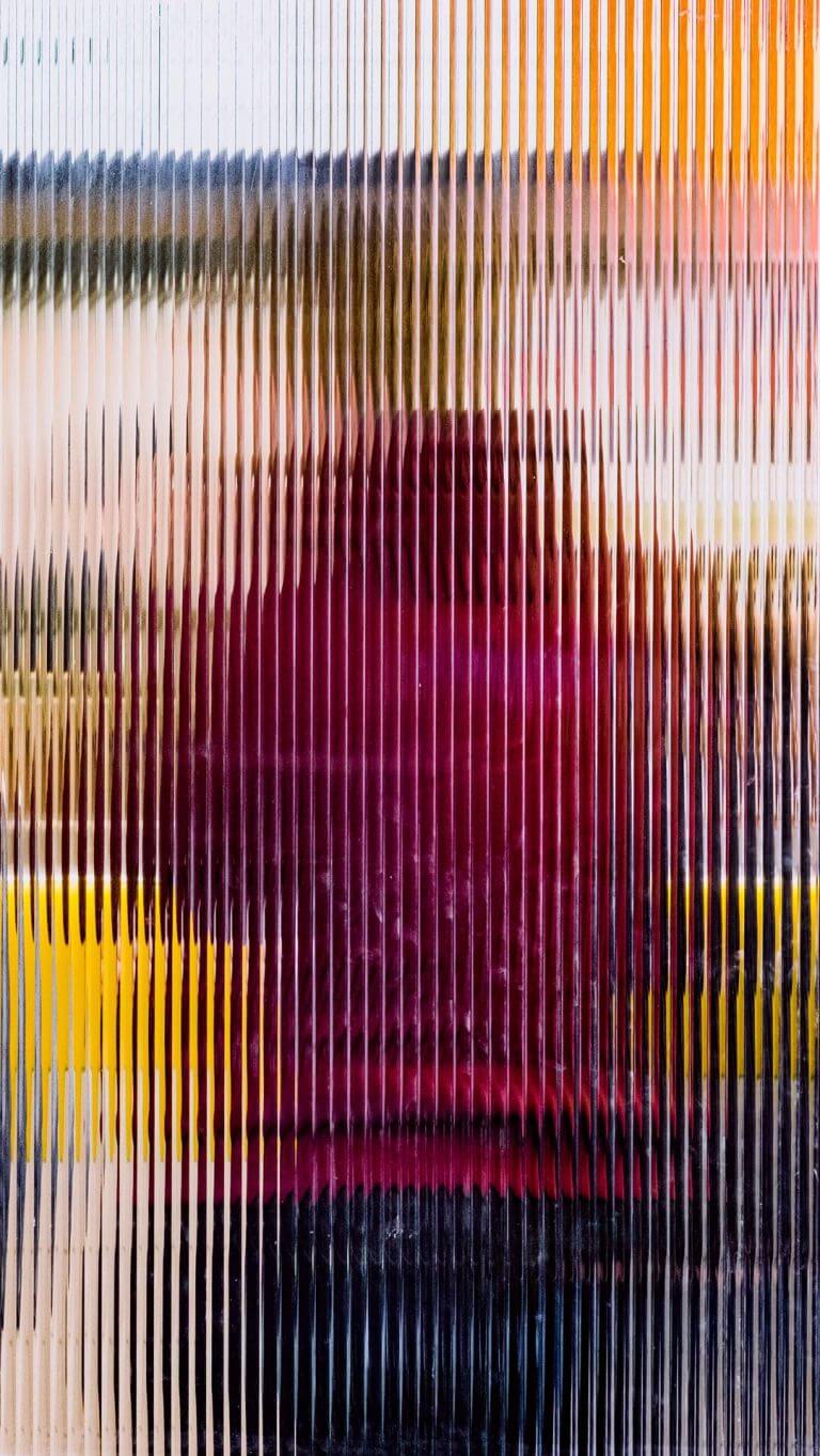 Blurred photograph of a person from the back with a red sweater