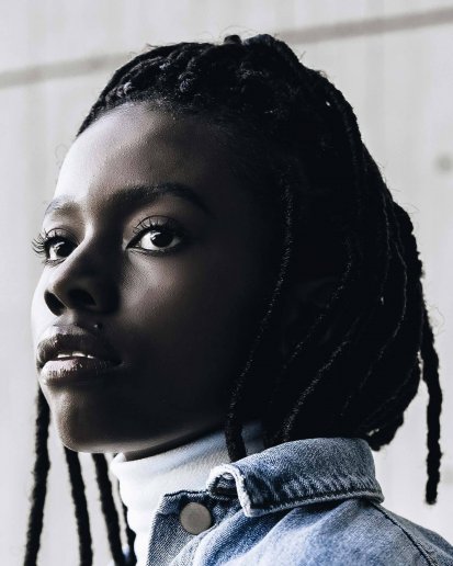 Black young woman with a jean jacket