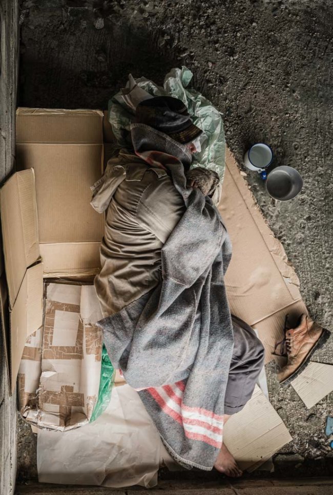 homeless-sleeping-on-the-floor Photo by APIWAN BORRIKONRATCHATA /Shutterstock.com